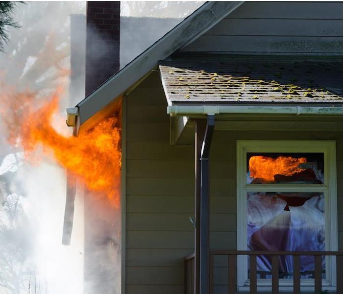  img src =”fire” alt = " photograph of a residential home on fire ” >